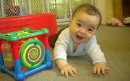 a baby lying on the floor