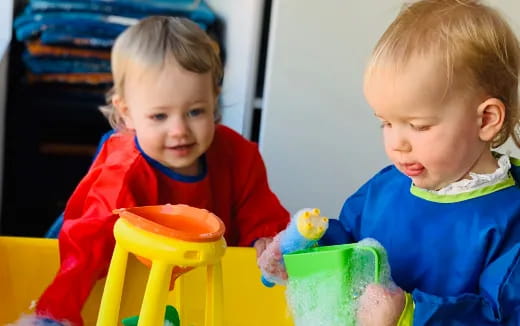 two children sitting at a table