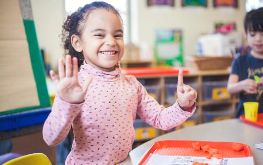 a young girl smiling
