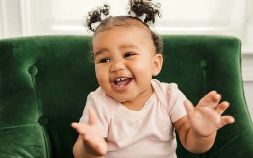 a baby with curly hair