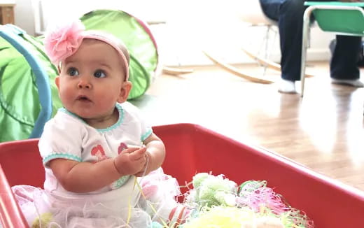 a baby sitting at a table