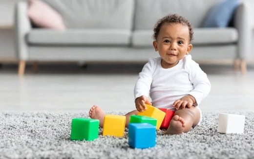 a baby playing with toys