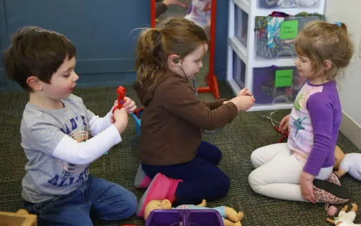 a group of children playing with toys
