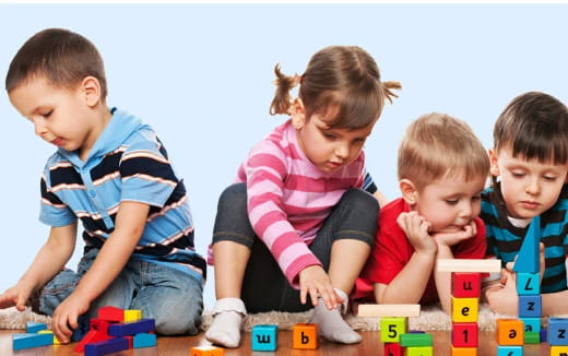 a group of children playing with toys