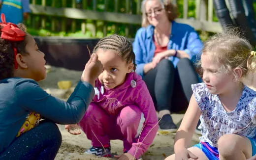 a group of people sitting on the ground