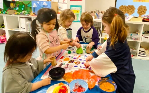 a group of children painting