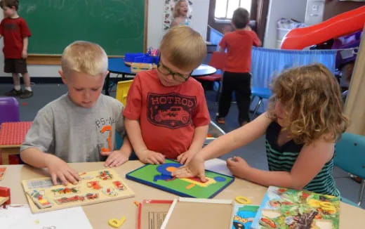 children sitting at a table