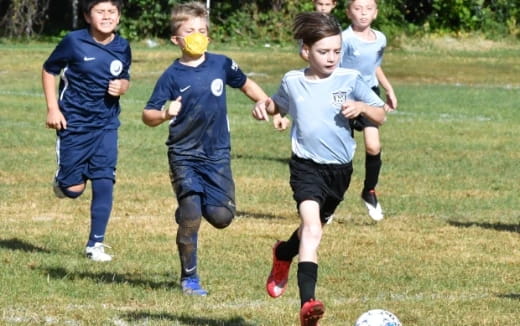 a group of girls playing football