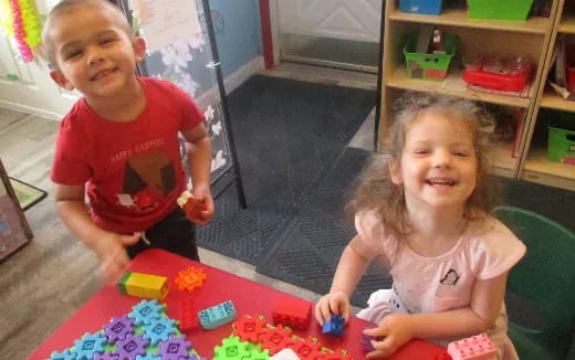 a couple of children playing with toys