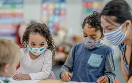a group of children with face paint