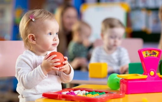 a baby playing with toys