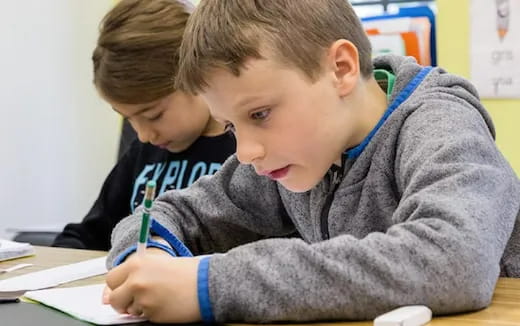 a few young boys studying
