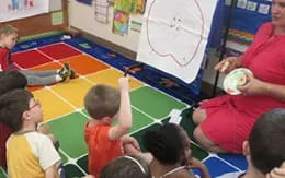 a group of children sitting on the floor