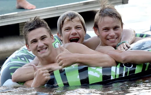 a group of kids in a pool
