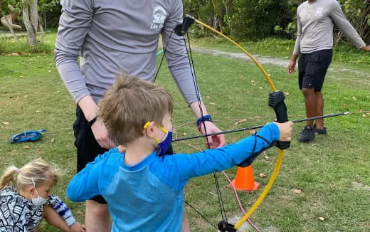 a group of people shooting bows