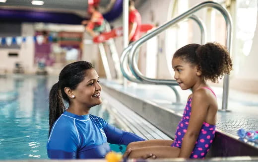 a person and a child in a pool