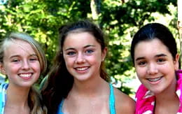 a group of girls smiling