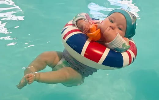 a baby in a pool