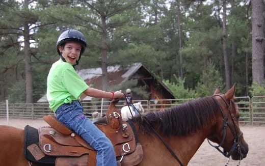 a girl riding a horse