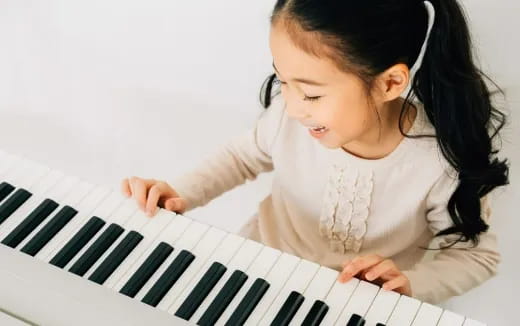 a baby playing piano