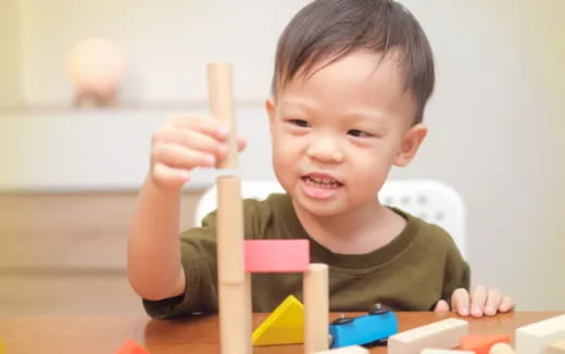 a baby playing with toys