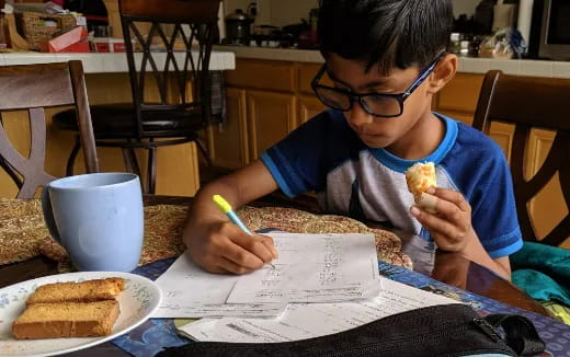 a boy eating a donut