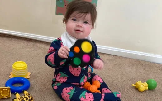 a child holding a toy