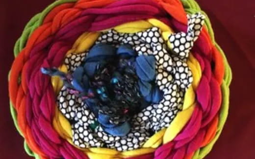 a colorful mask with a blue and yellow face