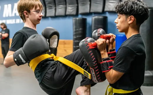 a couple of men boxing