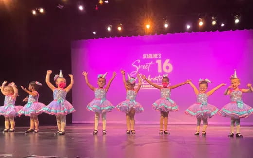 a group of girls in a performance