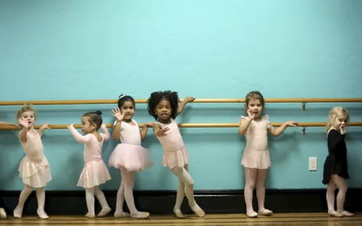 a group of girls in dresses