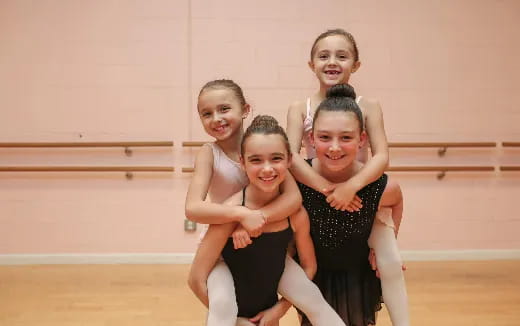 a group of girls posing for a photo