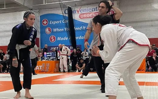 a group of people in a martial arts ring