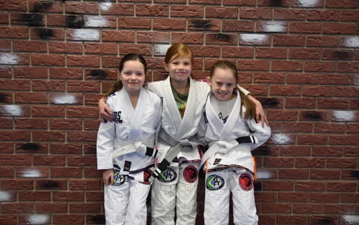 a group of people in white uniforms