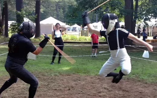 a group of people playing baseball