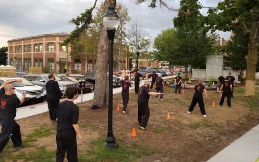 a group of people playing in a park