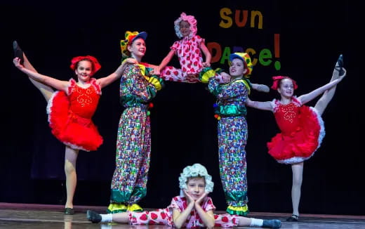 a group of women on stage