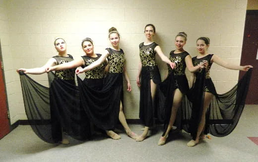 a group of women posing for a photo