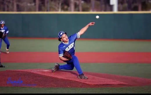 a kid throwing a baseball