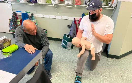 a man holding a baby