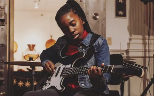 a man playing a guitar