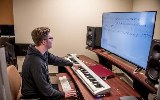a man playing a piano