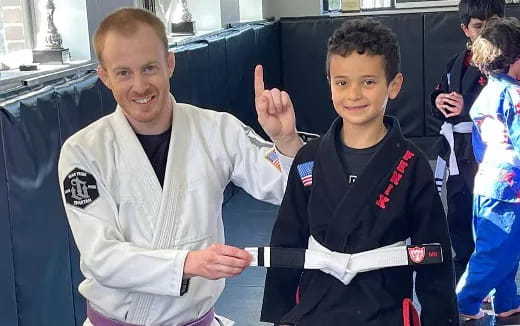 a person and a boy posing for a picture