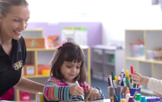 a person and a child painting
