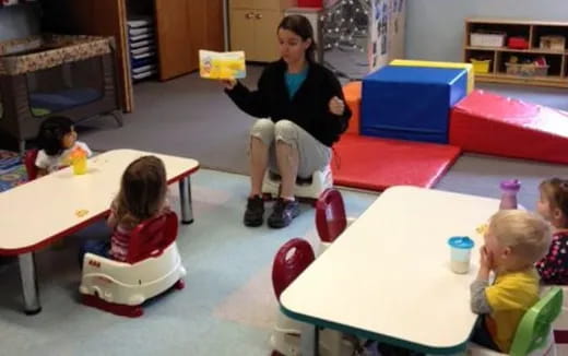 a person and several children in a room