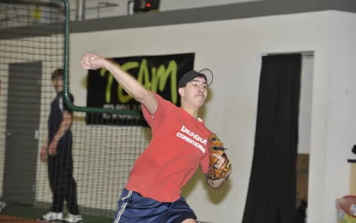 a person throwing a baseball