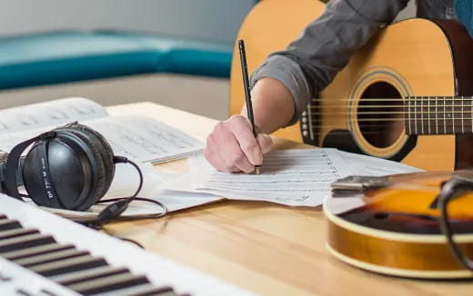 a person writing on a piece of paper