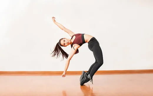 a woman dancing on a stage