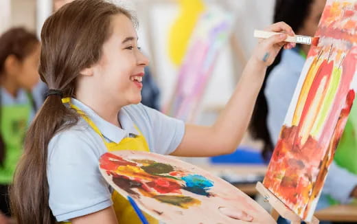 a young girl painting