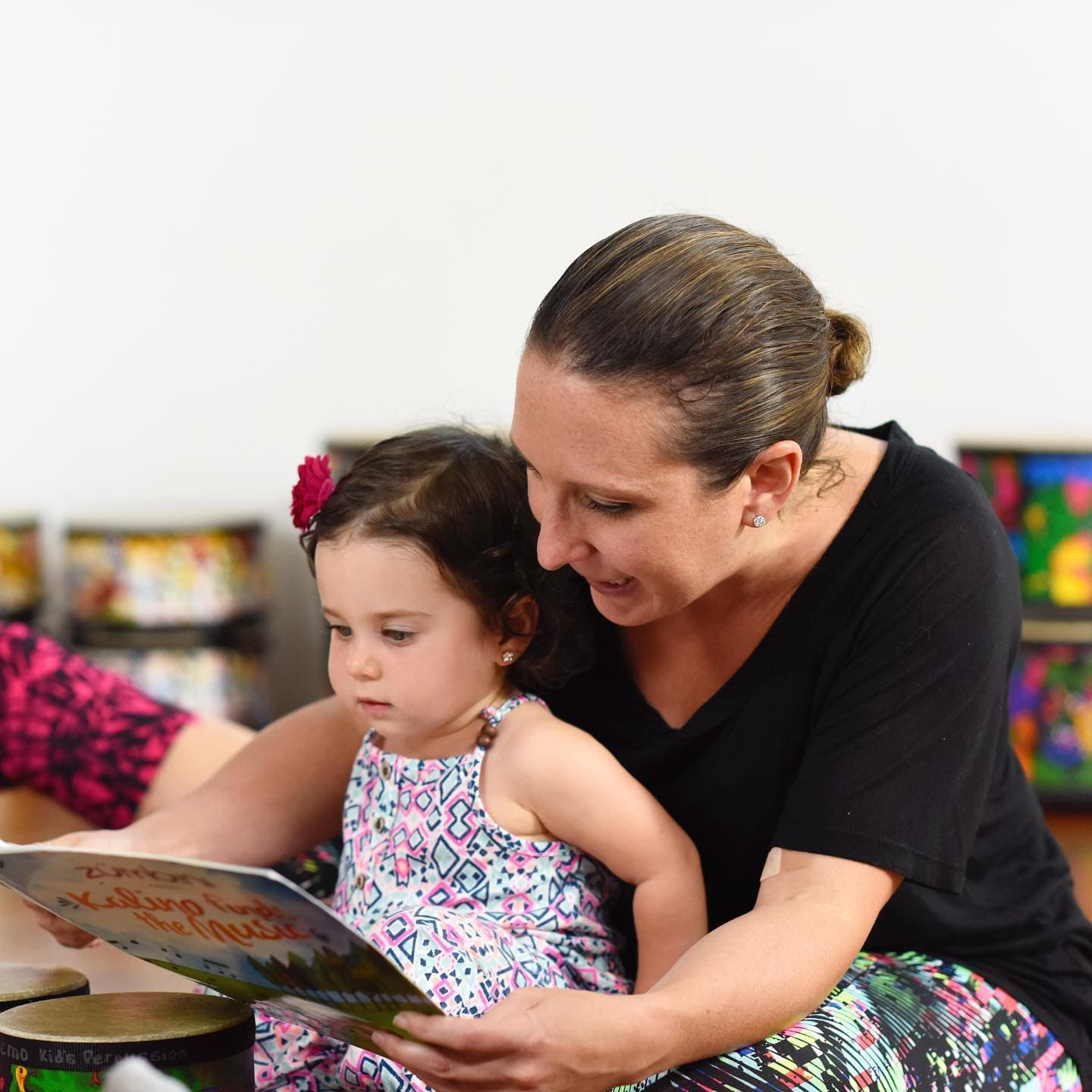 a person and a child playing drums